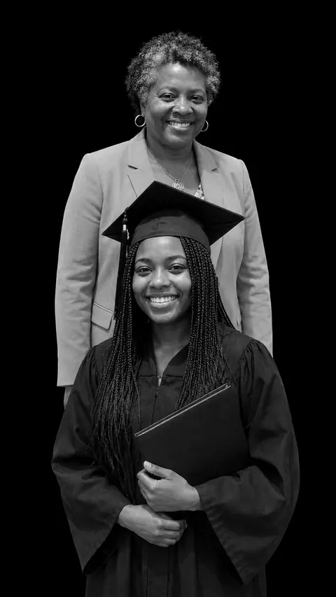 A graduate and her mother in a stacked monochrome studio portrait, the young woman in cap and gown holding her diploma at the front